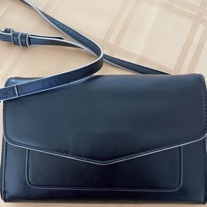 Vera Bradley leather crossbody wallet.